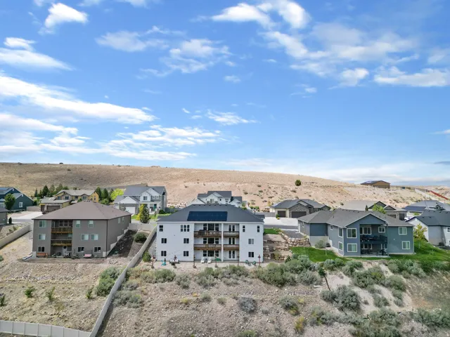 Residential community with varied architectural styles and surrounding natural landscape