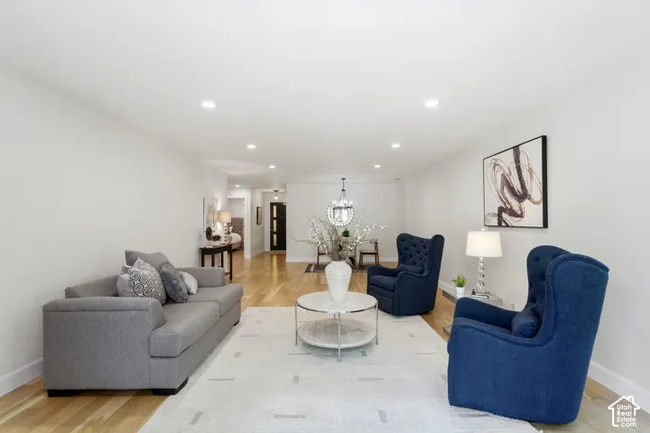 Recessed lighting illuminates the wood-finish flooring