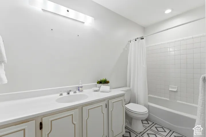 White vanity with an integrated sink and brushed nickel faucet