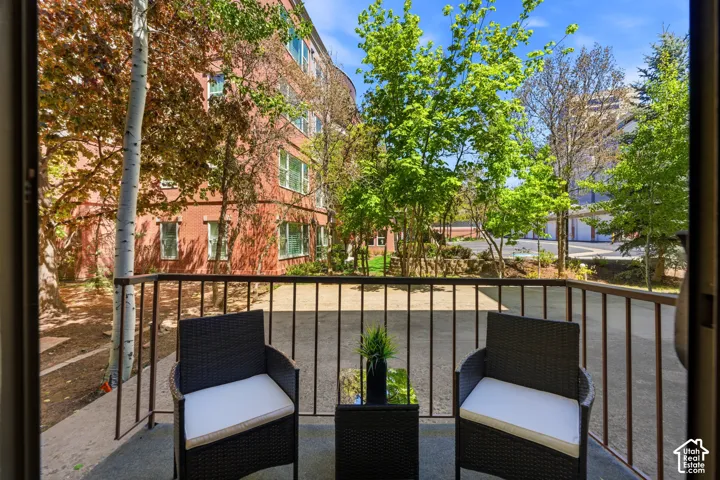 Private balcony with dark metal railing