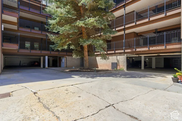 Multi-story building with concrete exterior and dark metal railings