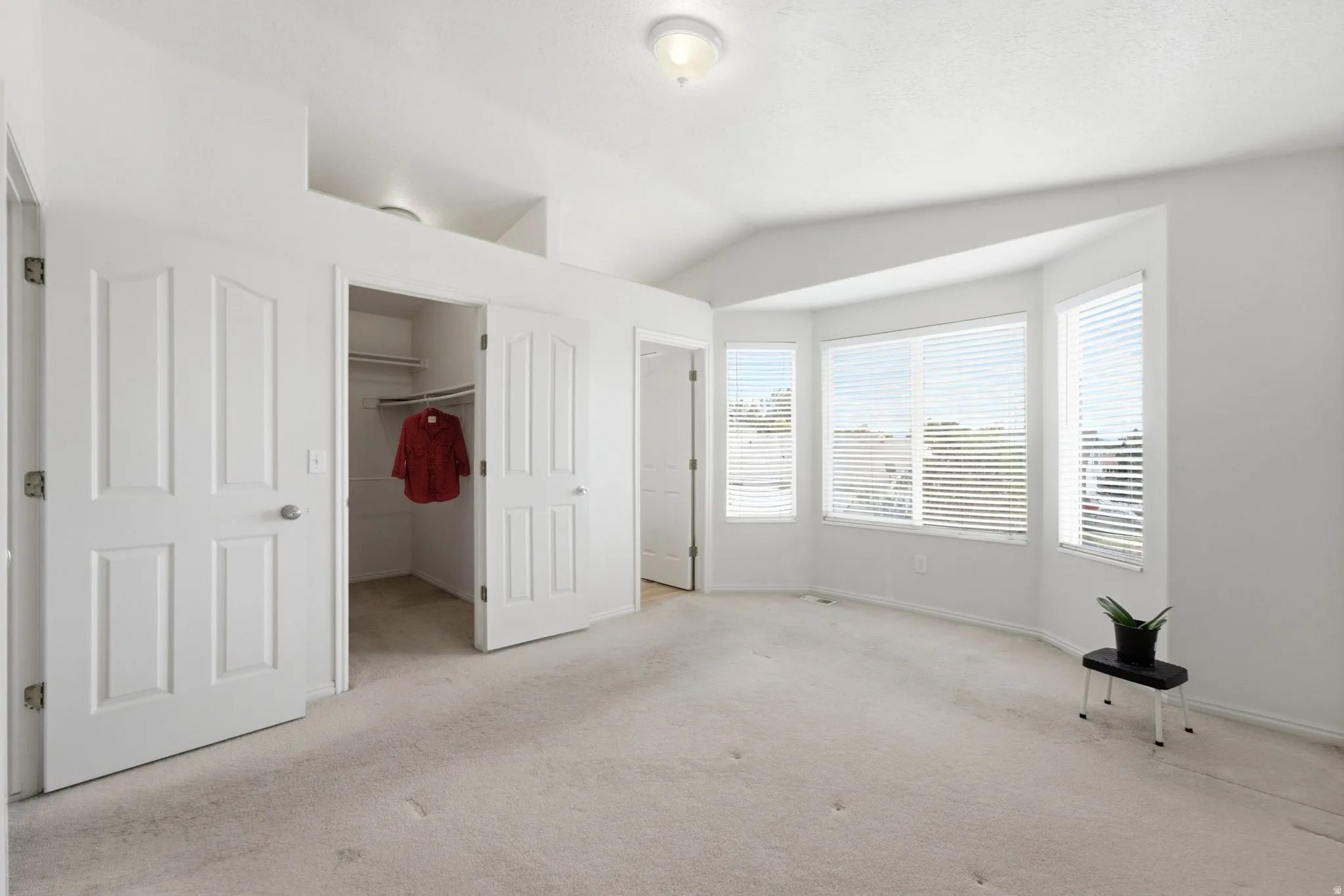 Vaulted ceiling with overhead lighting