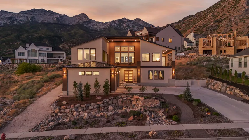 Contemporary architecture featuring a multi-level design with expansive windows and a flat roofline