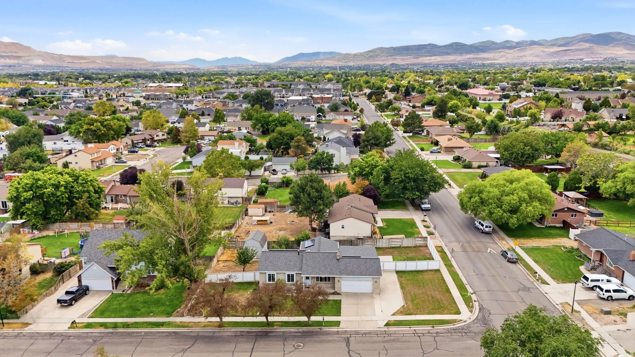 Residential neighborhood with established street infrastructure and mature trees