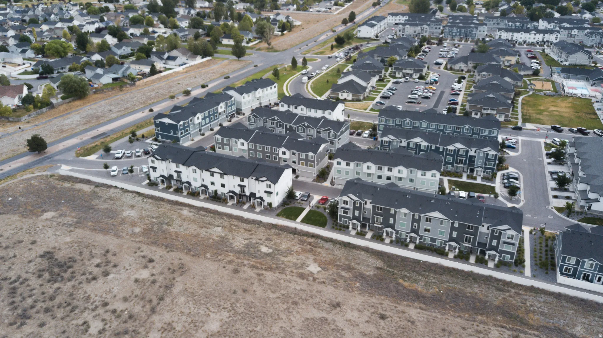 Residential area featuring multi-story townhomes and single-family residences