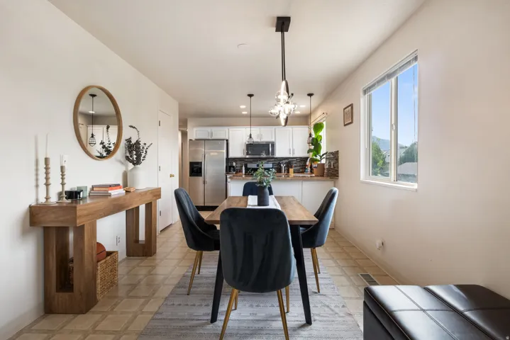 Tiled flooring extending through the dining area and kitchen