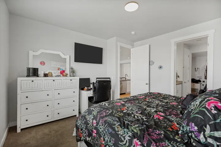 Recessed ceiling lighting, light gray wall tones, and carpet flooring