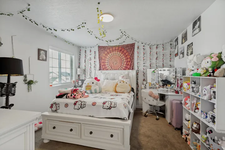 White walls, recessed window with blinds, and brown carpet flooring