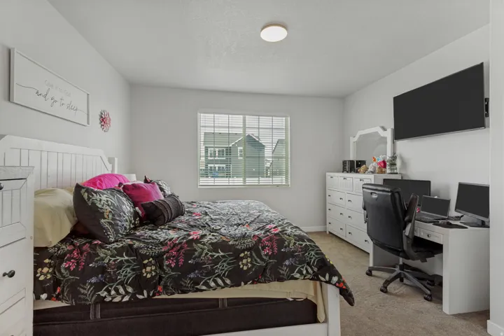White paneled headboard and nightstand