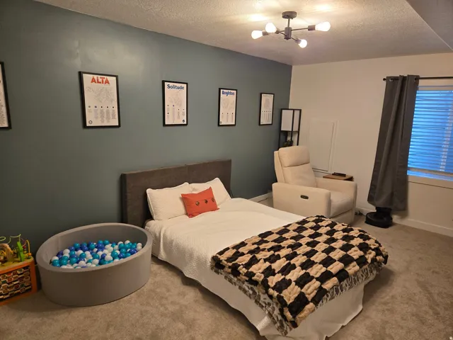 Wall-to-wall carpeting, recessed lighting, and a modern ceiling light fixture