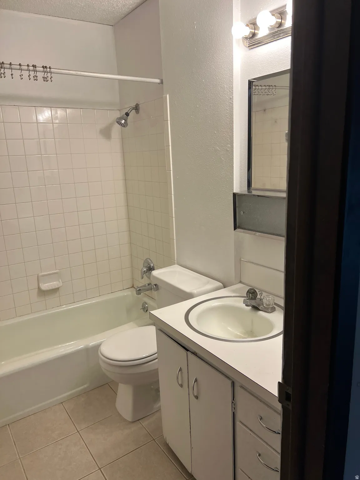 Full bath, tile floor and surround