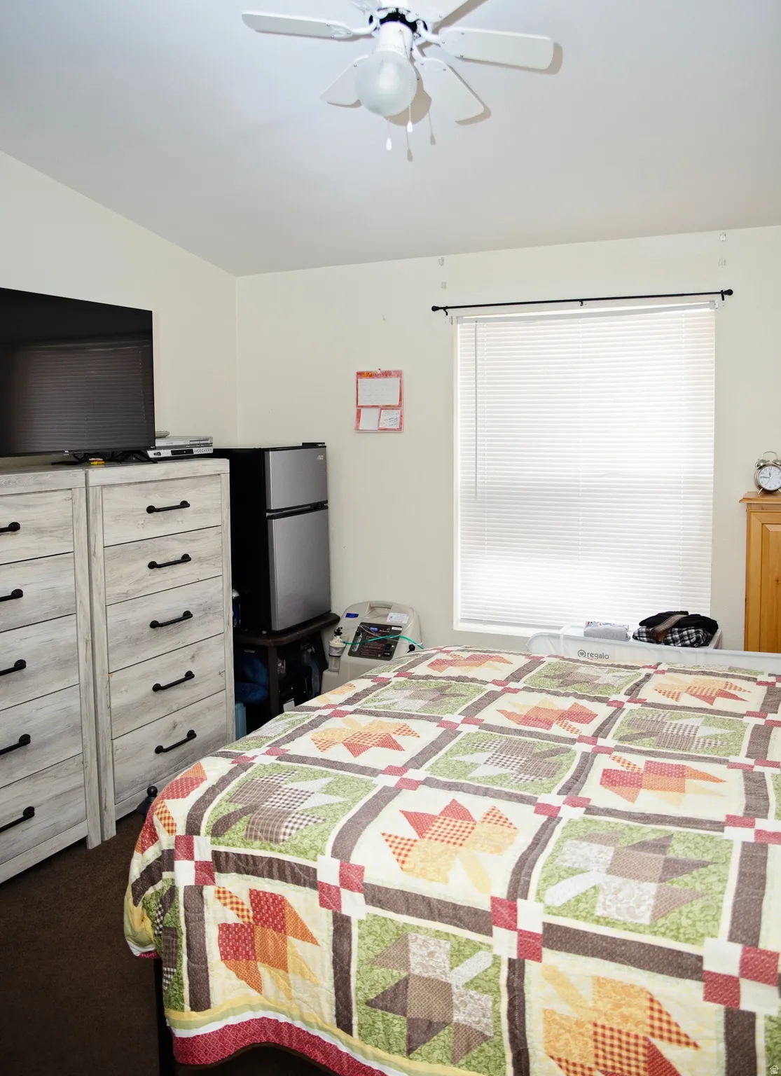 Ceiling fan fixture and a window with blinds