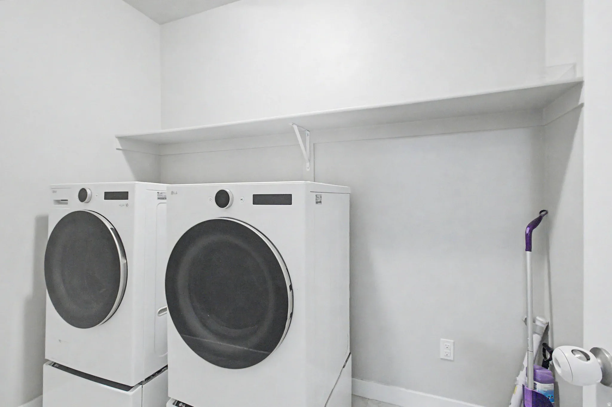 White walls with a single shelf
