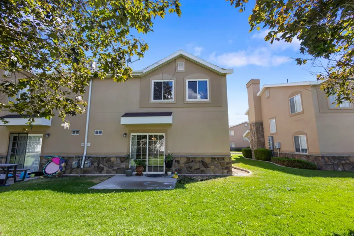 Two-story exterior with stucco finish and stone veneer accents