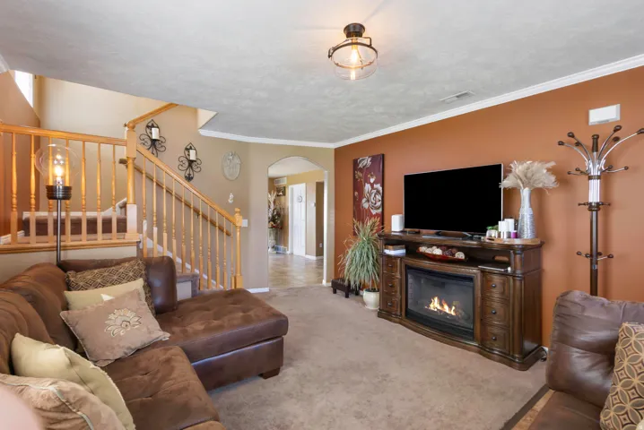 Warm-toned walls accenting a built-in fireplace with a mantel