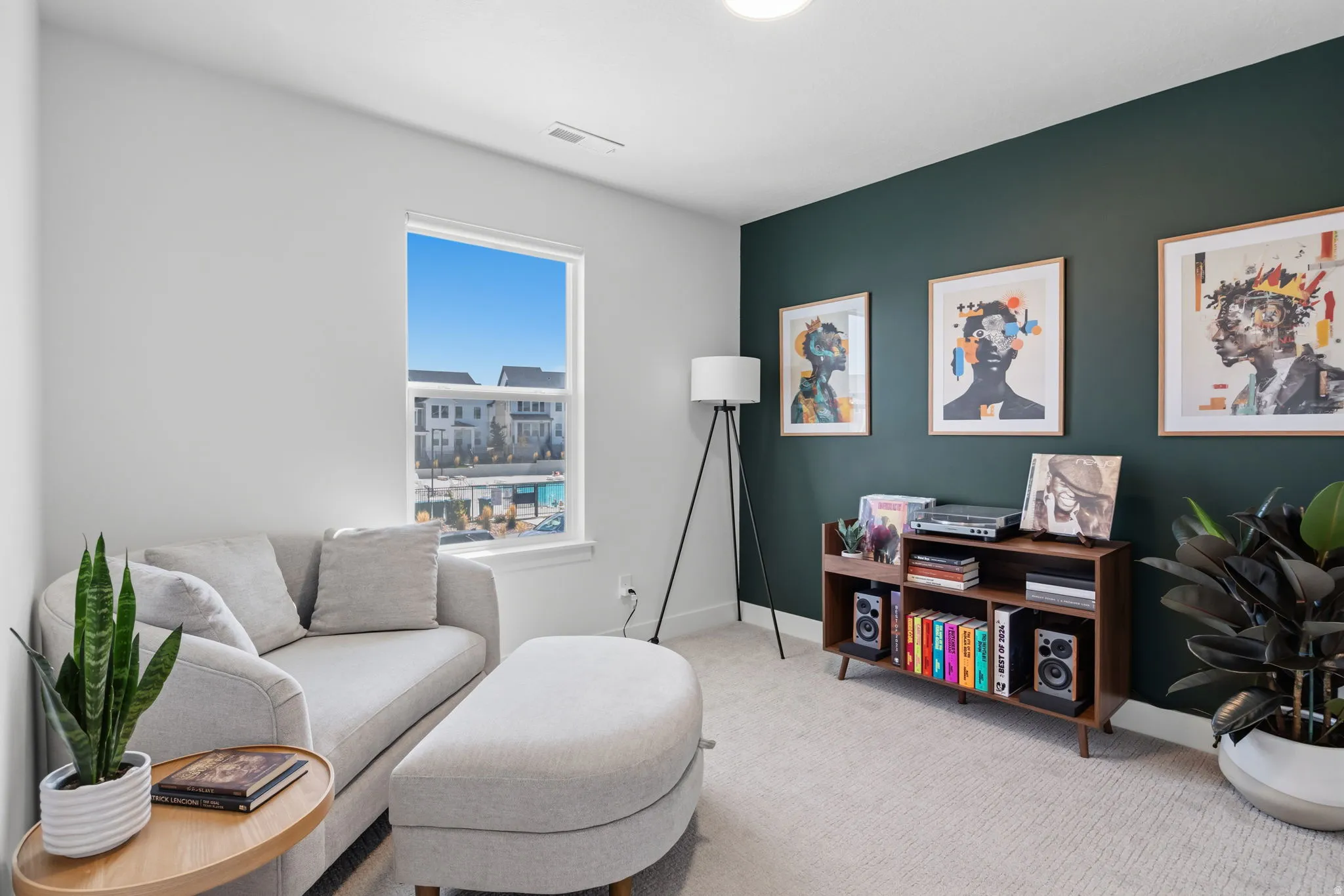 Carpeted flooring, recessed lighting, and a prominent window