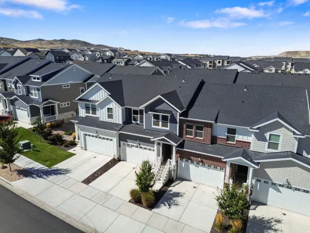 Aerial perspective of a multi-unit property featuring distinct architectural designs