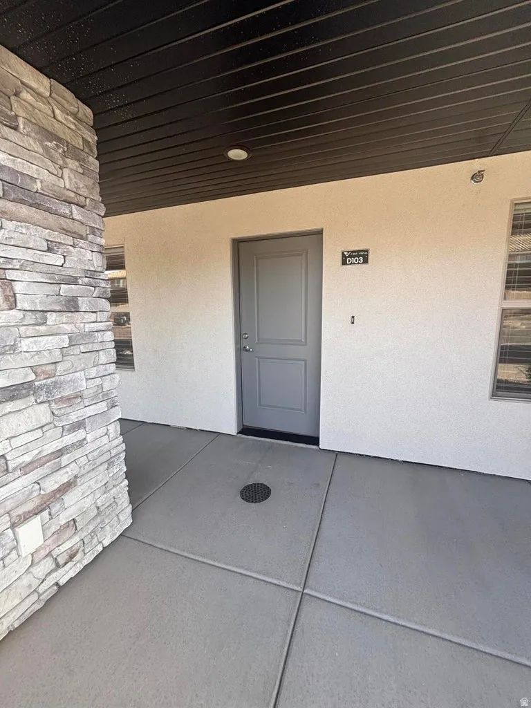Stacked stone column with exterior soffit lighting