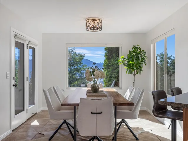 Recessed lighting, tiled flooring, built-in breakfast bar, French doors, and scenic mountain backdrop