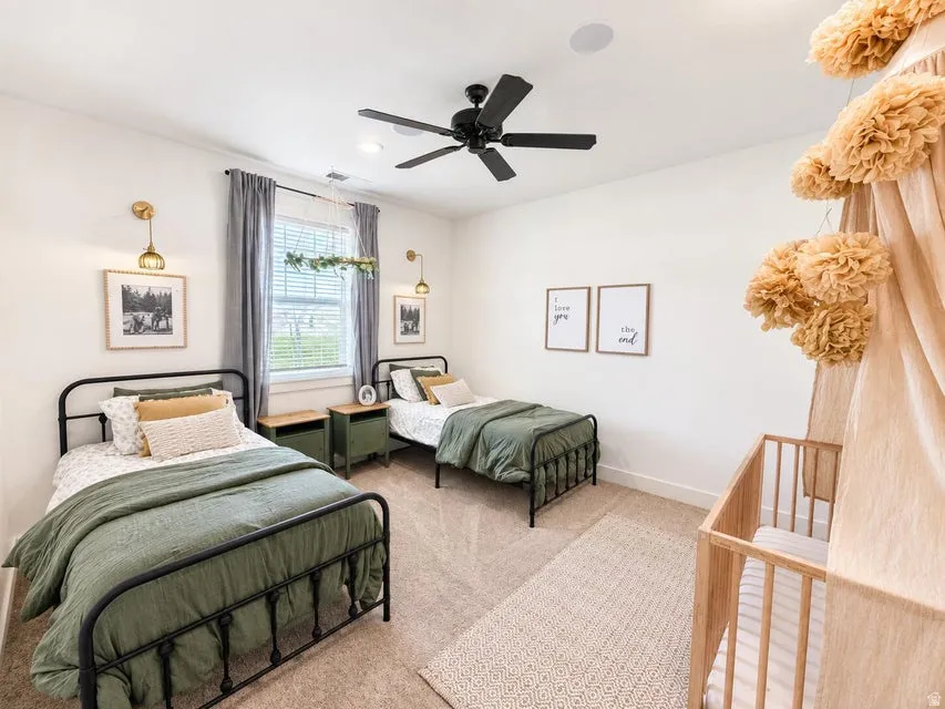 Wall-to-wall carpeting, recessed lighting, and a ceiling fan with light fixture