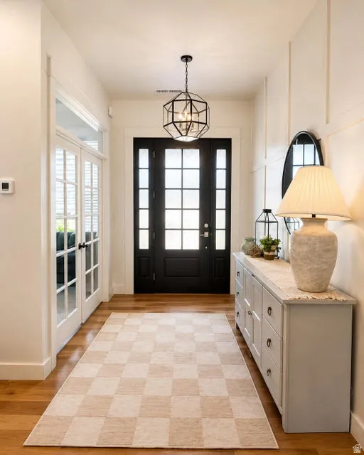 Hardwood-finish flooring with a modern geometric chandelier