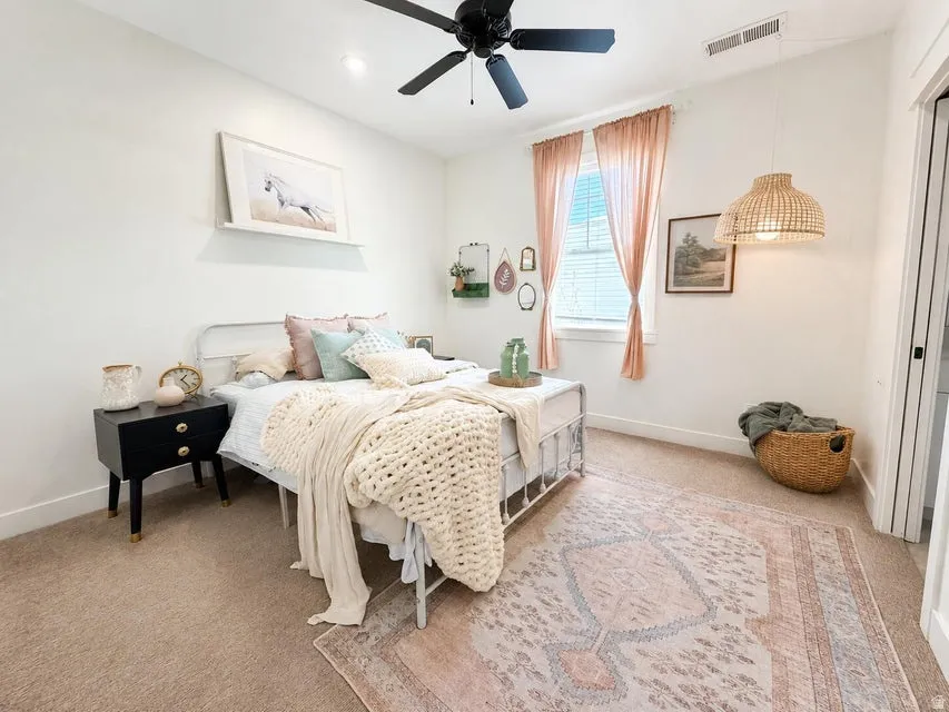 Recessed lighting, ceiling fan, window with blinds, wall-mounted shelf, and carpeted flooring
