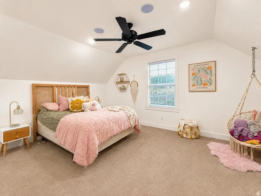 Vaulted ceilings with recessed lighting and a ceiling fan