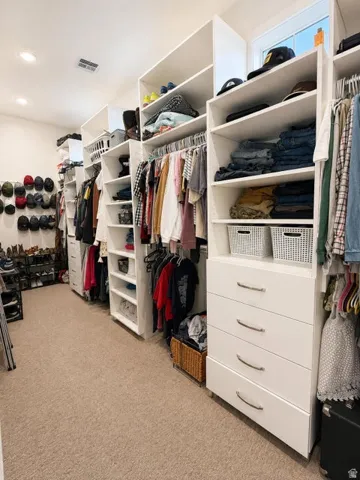 Custom closet system featuring built-in shelving, hanging rods, and integrated drawer storage