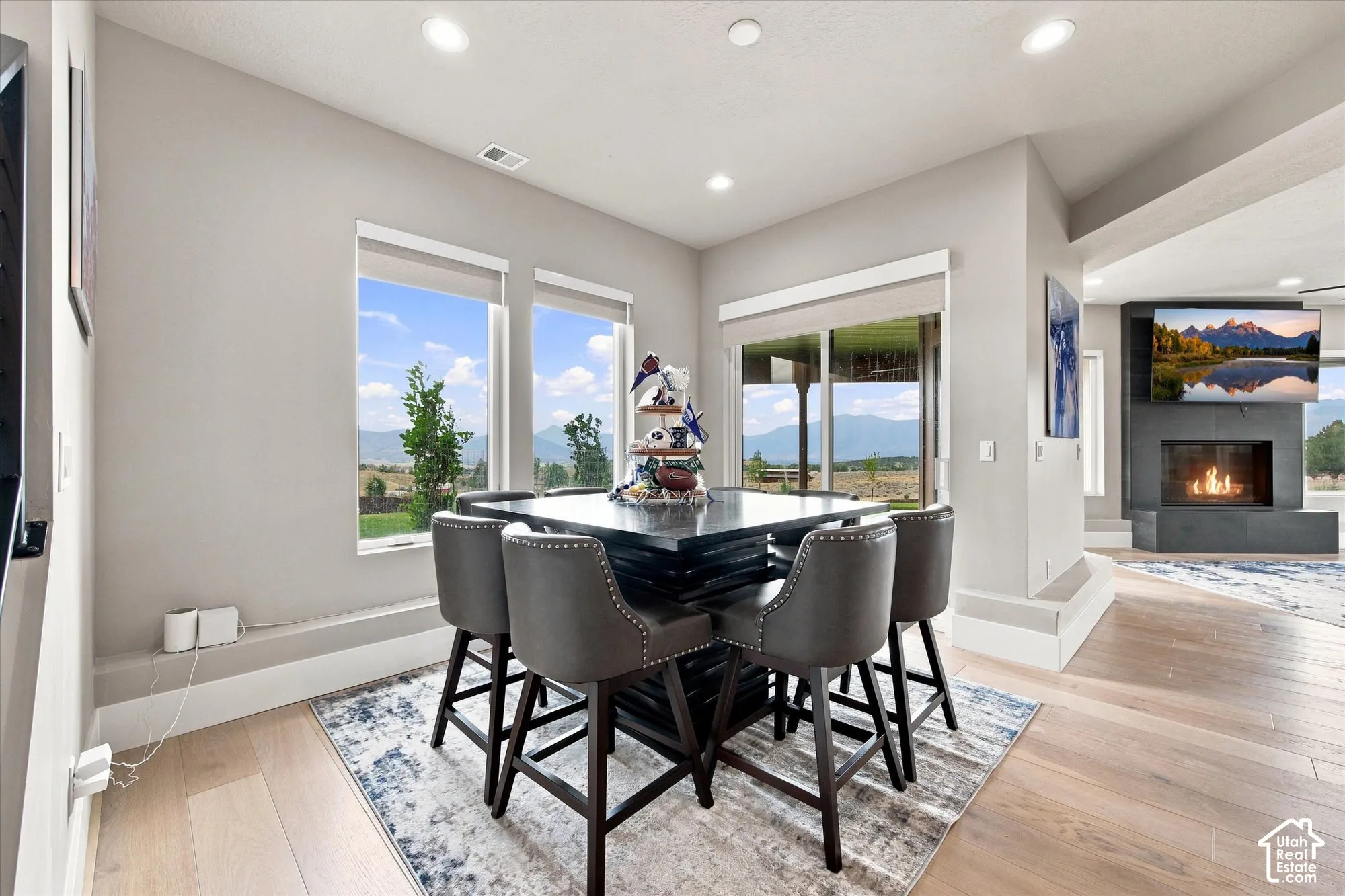 Recessed lighting, wood-finish flooring, and a built-in fireplace