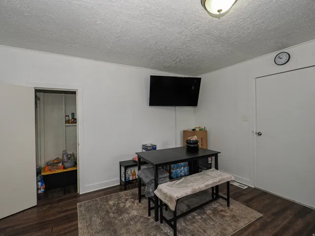 Wood-finish flooring with white baseboards