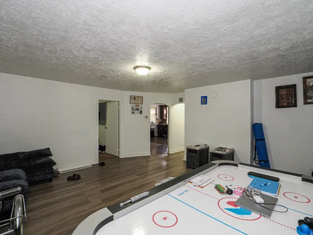 Wood-finish flooring throughout the room