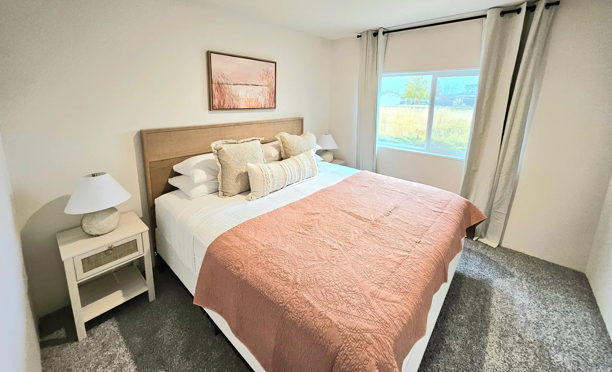 Carpeted flooring, window with natural light, and a built-in closet
