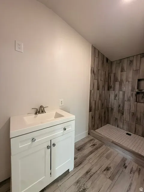 White single vanity with integrated sink and chrome faucet