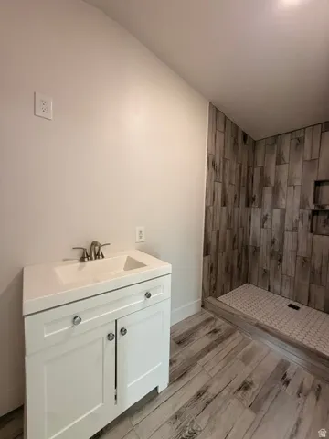 White single vanity with integrated sink and chrome faucet