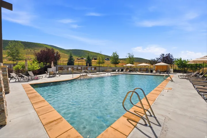 Expansive swimming pool with integrated spa and water features
