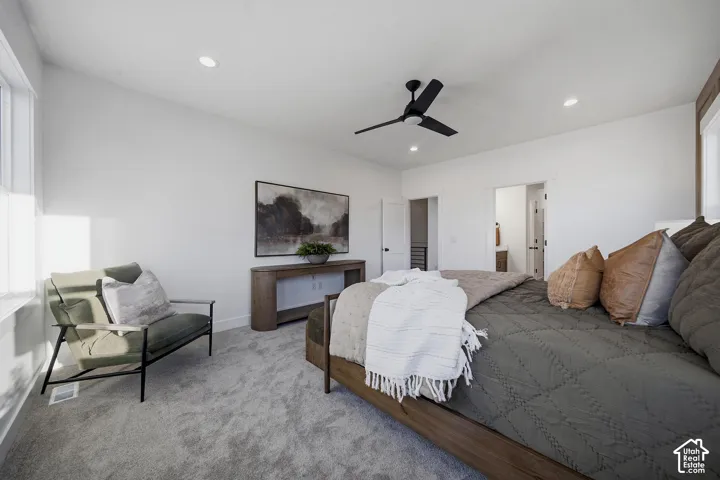 Recessed lighting, wood-finish flooring, and a modern ceiling fan
