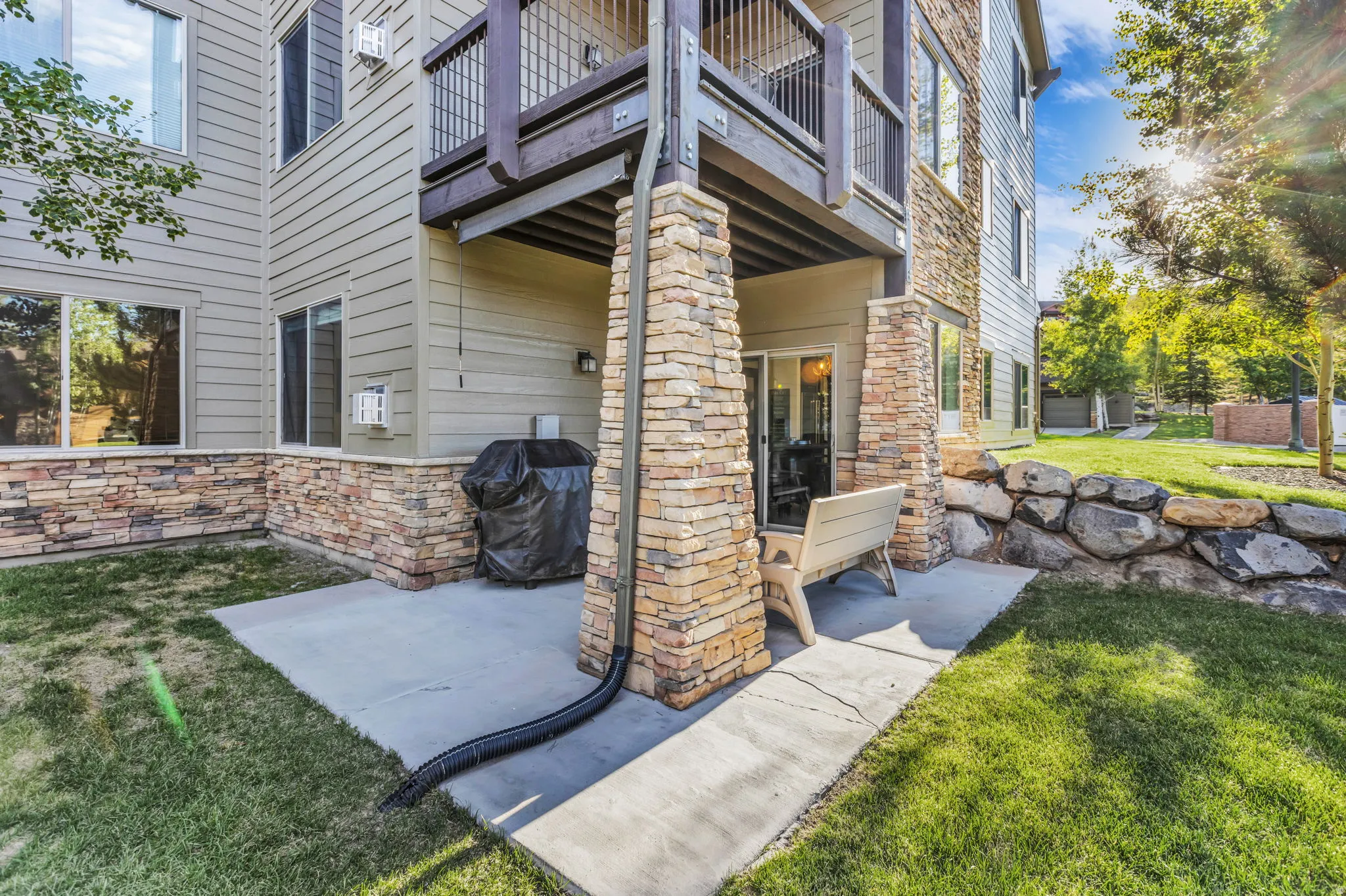 Ground-level patio with concrete surfacing and direct outdoor access