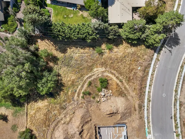 Graded parcel with visible excavation, including a concrete foundation