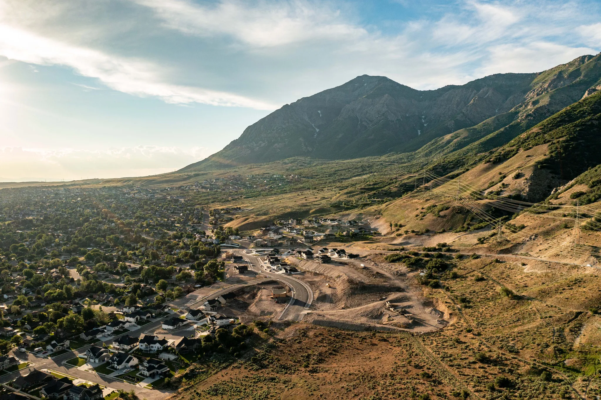 Expansive mountain backdrop with a developed residential area
