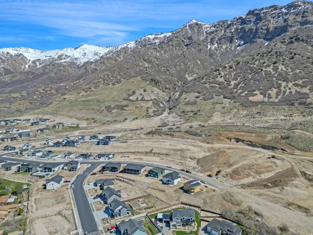 Mountain backdrop featuring snow-capped peaks and rugged terrain