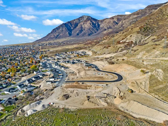 New construction community with paved roads and mountain backdrop