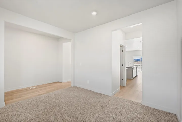 **DISCLAIMER** Interior package may vary. Recessed lighting, wood-finish flooring, and light-toned carpeting