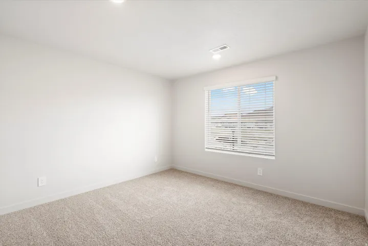 **DISCLAIMER** Interior package may vary. Wall-to-wall carpeting, recessed lighting, and window with blinds