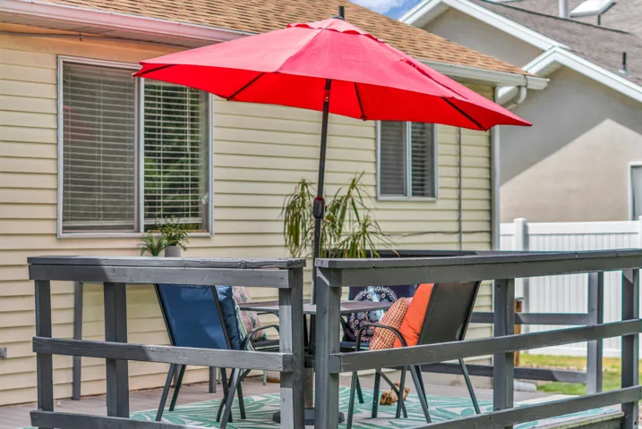 Exterior siding, multiple windows, and a built-in outdoor deck