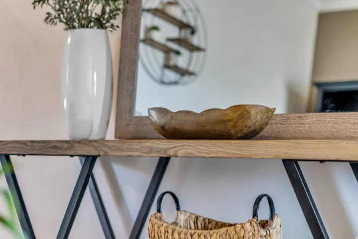 Wood-finish console table with black metal legs