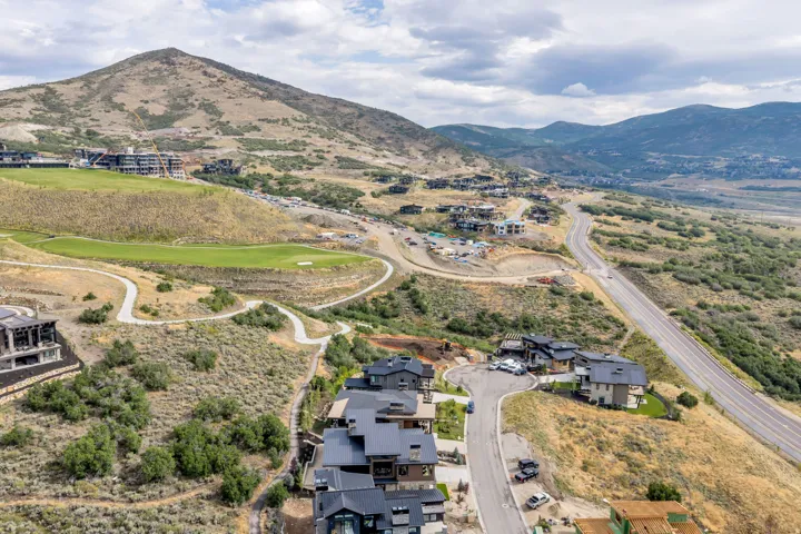 Dramatic hilltop setting with panoramic vistas across rolling terrain and distant mountains