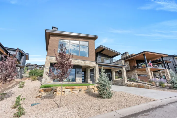 Contemporary exterior with stone and wood-look siding
