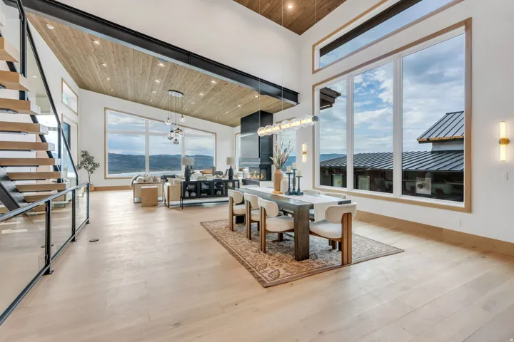 Wood-finish flooring throughout, with a wood-paneled ceiling and exposed structural beam