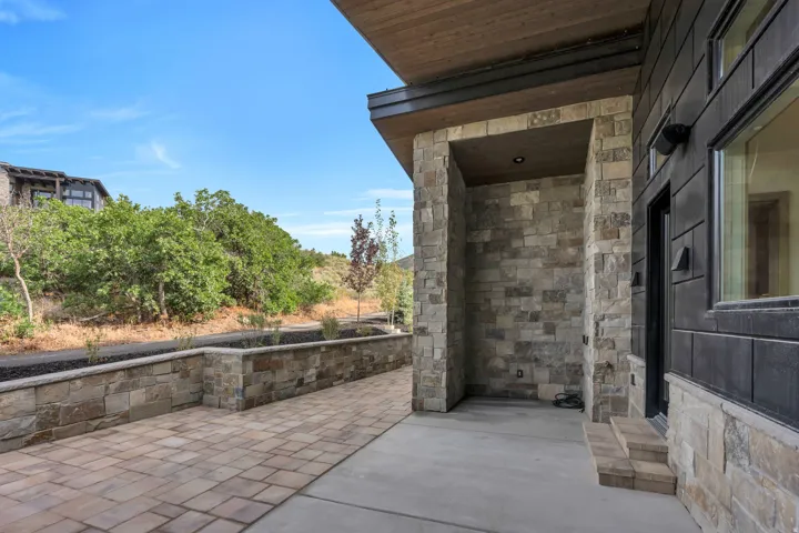 Stone veneer exterior with wood-finish soffit