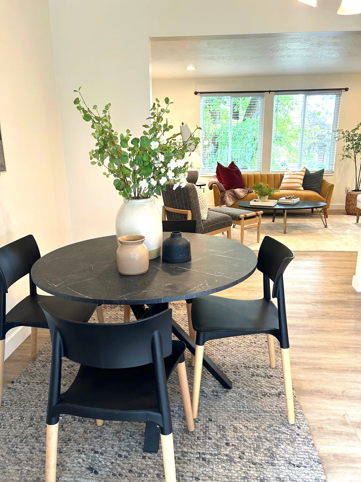 Recessed lighting, wood-finish flooring, and large windows with blinds